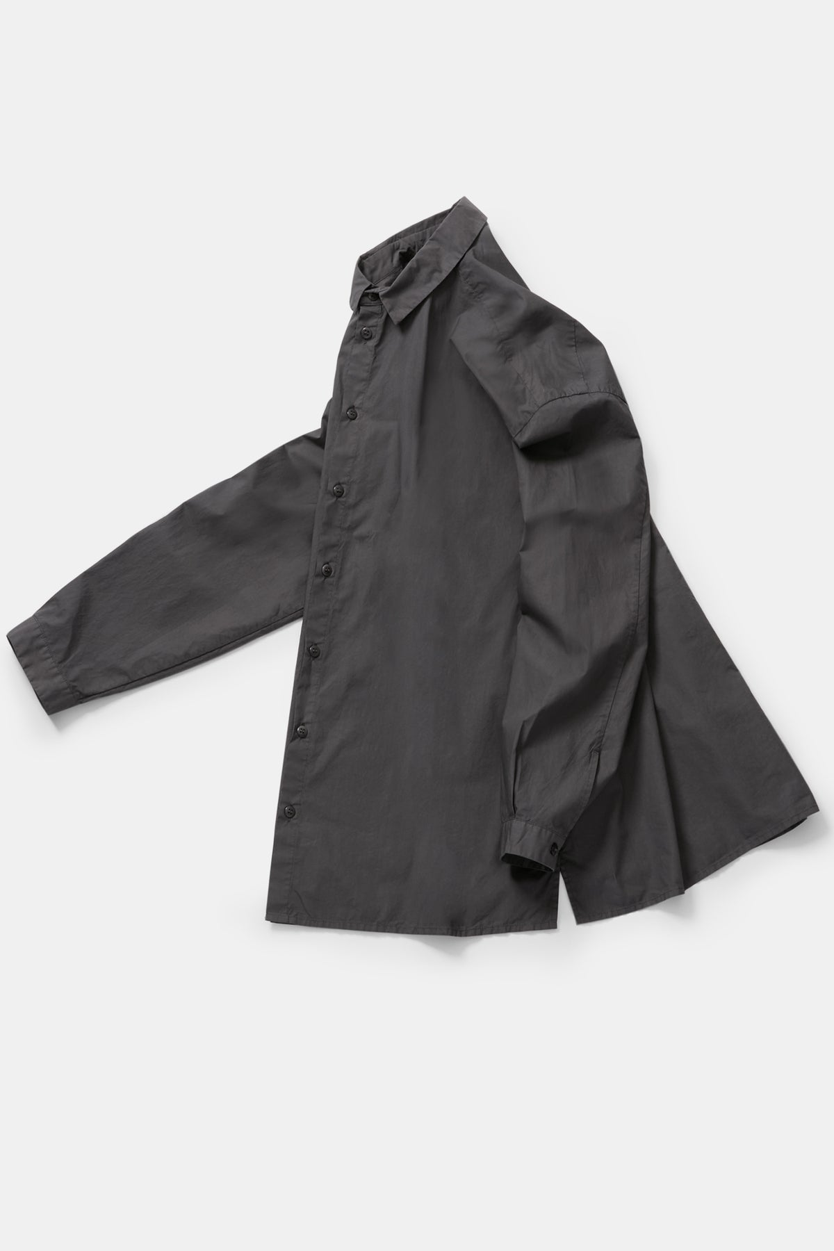 profile product view of toogood draughtsman shirt poplin pencil emphasizing the long tapered sleeves and side slit details