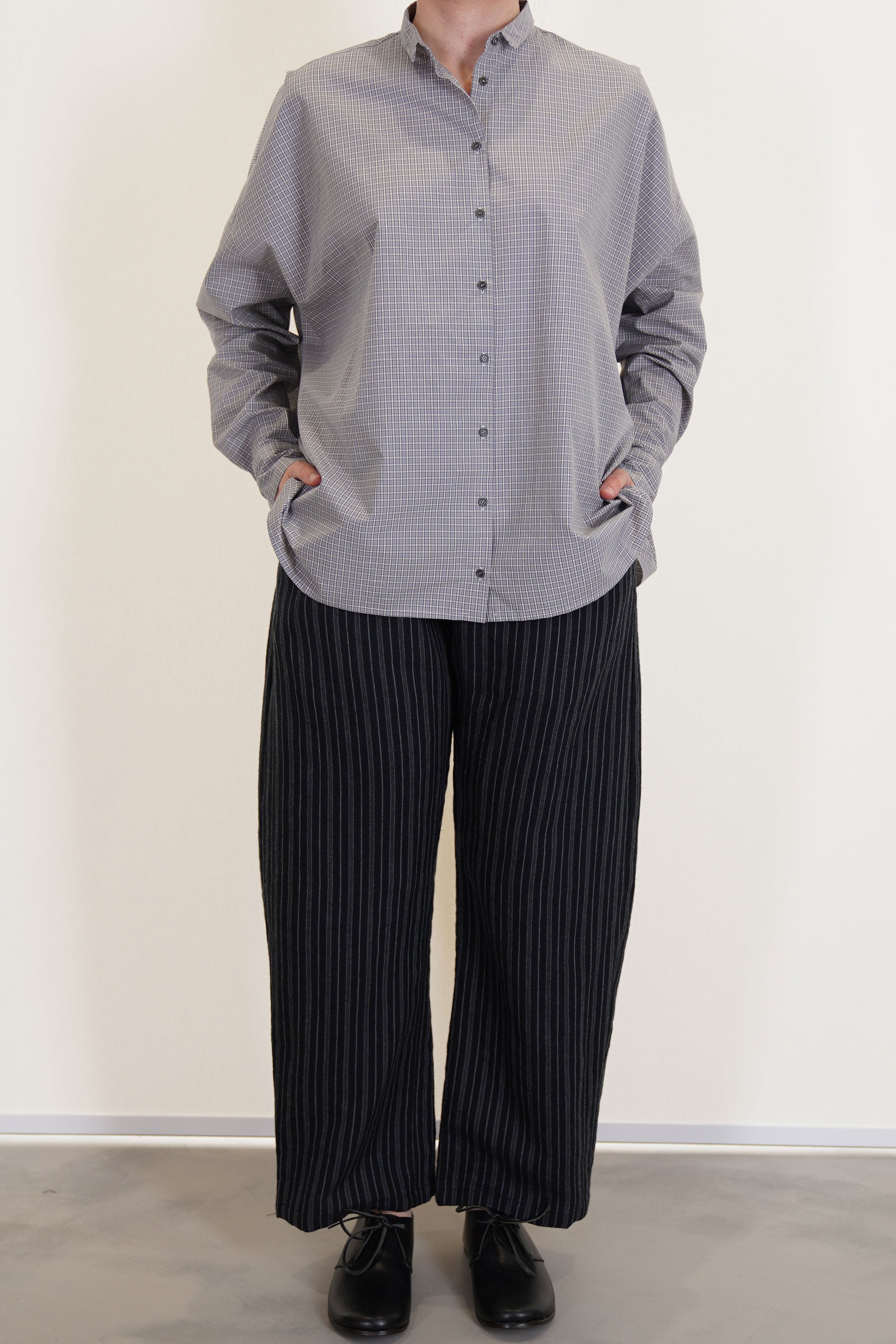 apuntob (a.b) trousers stripes black worn with wide shirt gray check