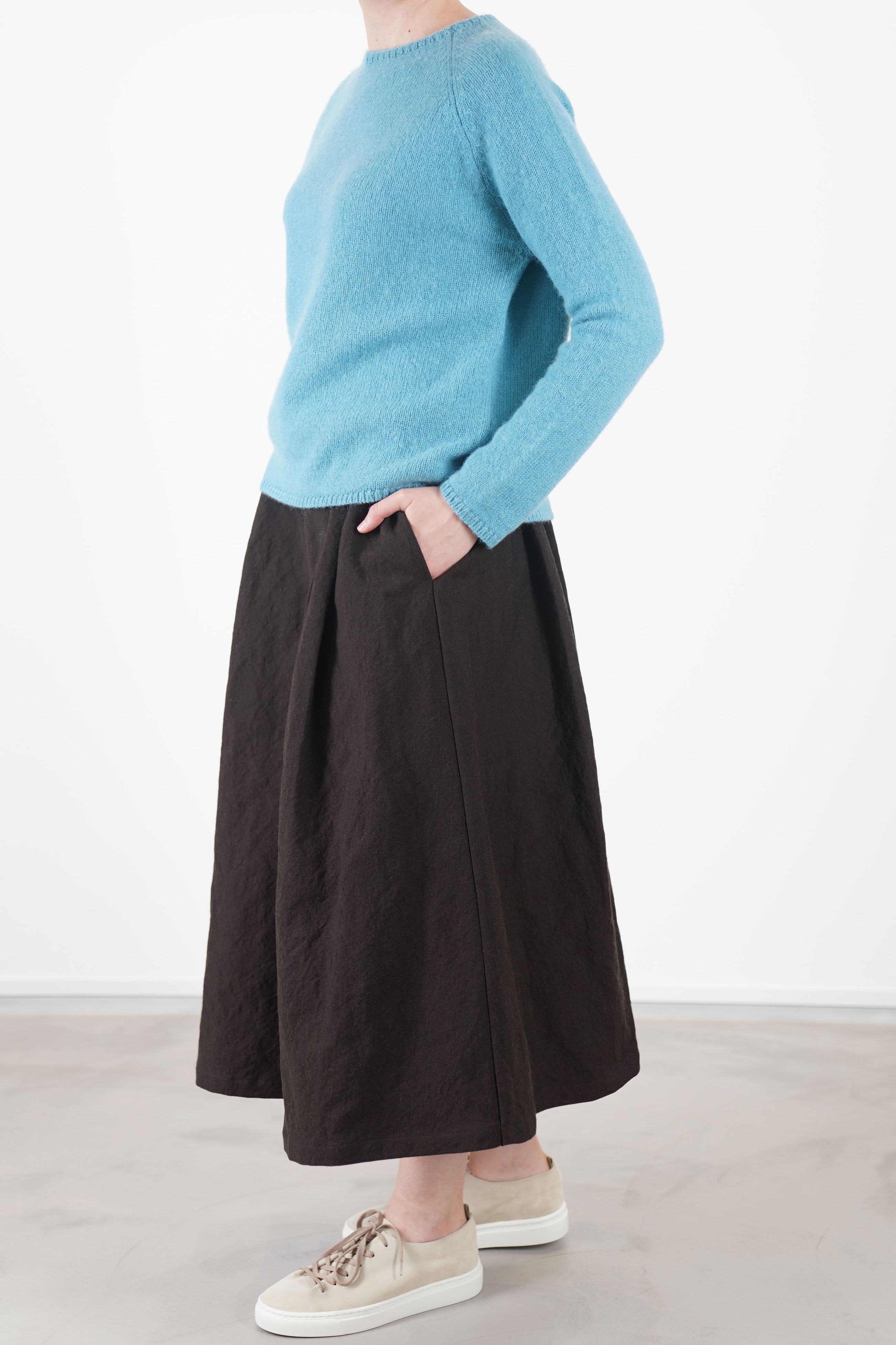 side view of apuntob (a.b) knitwear cashmere alpaca sea crafted from a soft and warm blend of cashmere and alpaca.