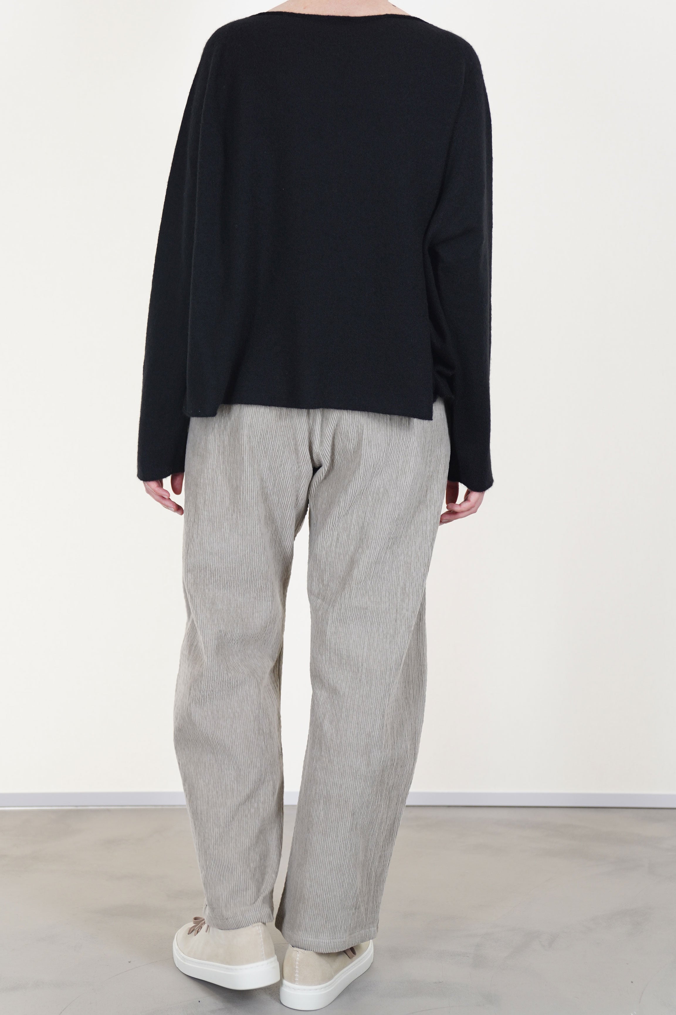 back view of apuntob (a.b) wool silk knitwear black designed with a flattering boat neckline and loose cut