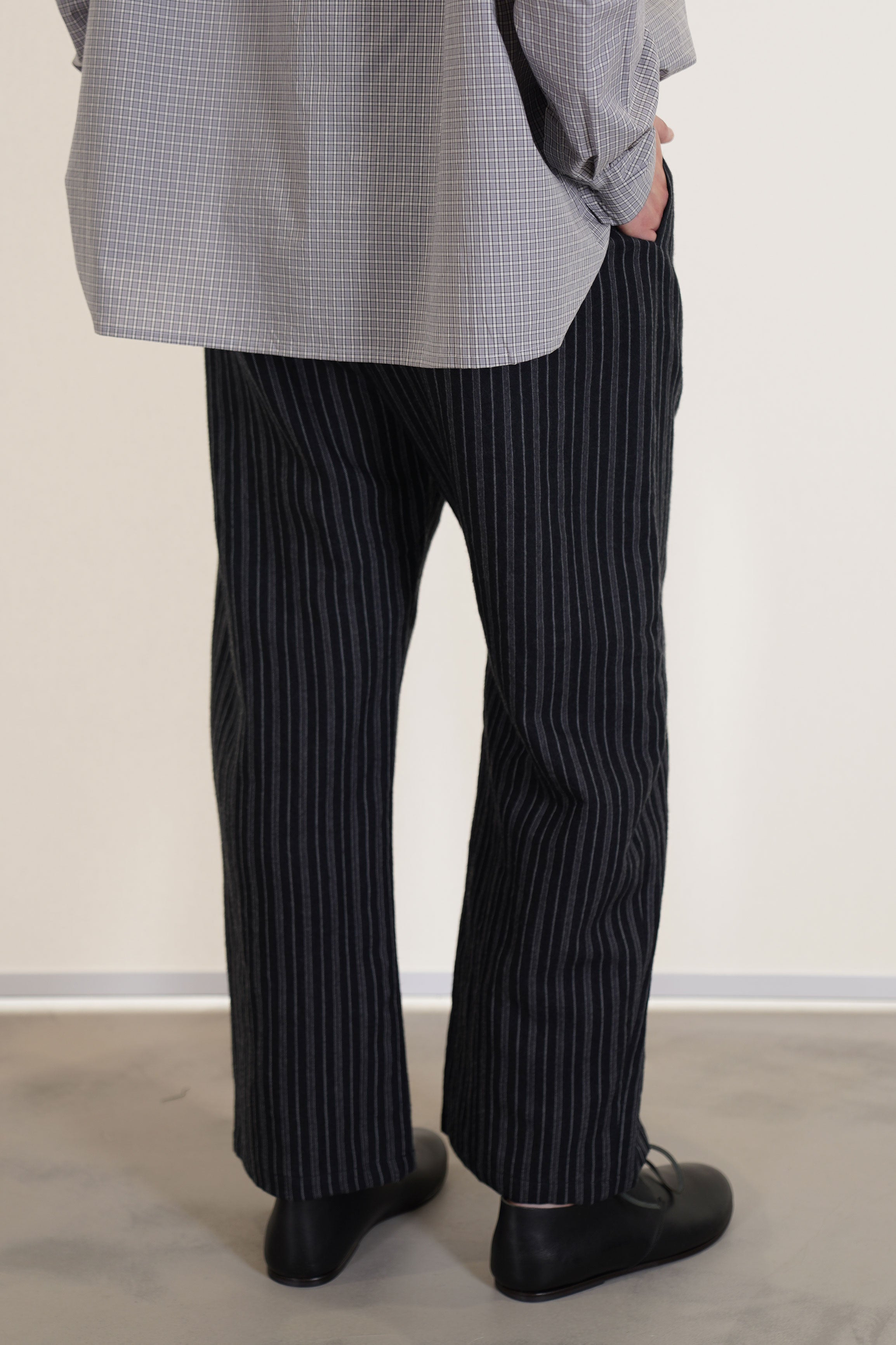 back view if apuntob (a.b) trousers stripes blackrelaxed fit, long slightly curved leg