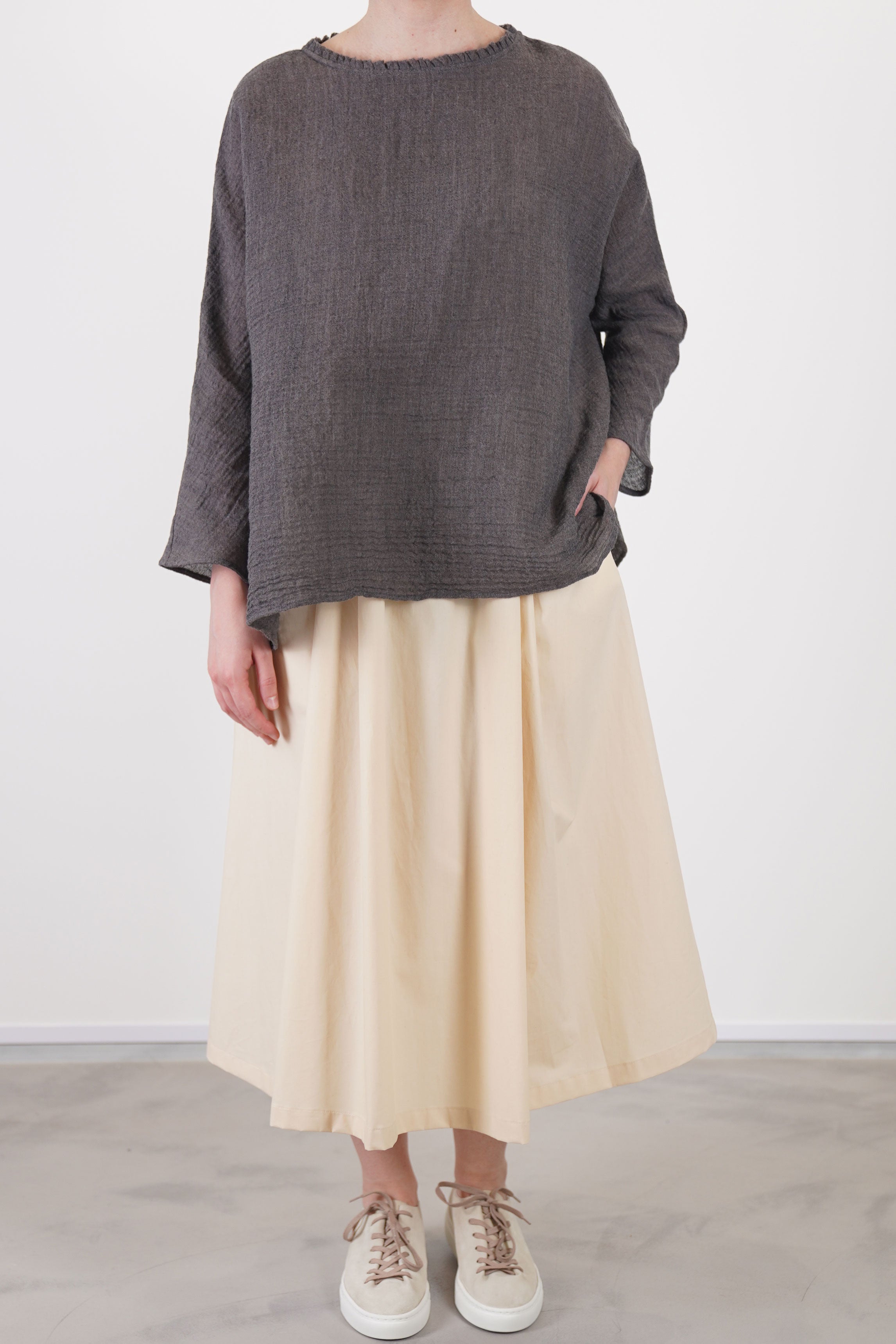 front view of apuntob (a.b) linen wool shirt walnut showcases subtle ruffle accents at the neckline and a wide and relaxed silhouette