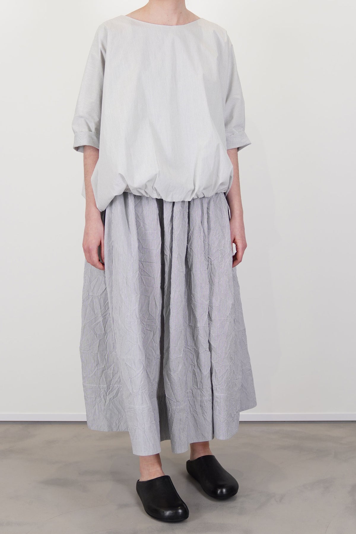 moel wearing apuntob (a.b) shirt fine stripes meringue with a matching skirt for an everyday minimalist style