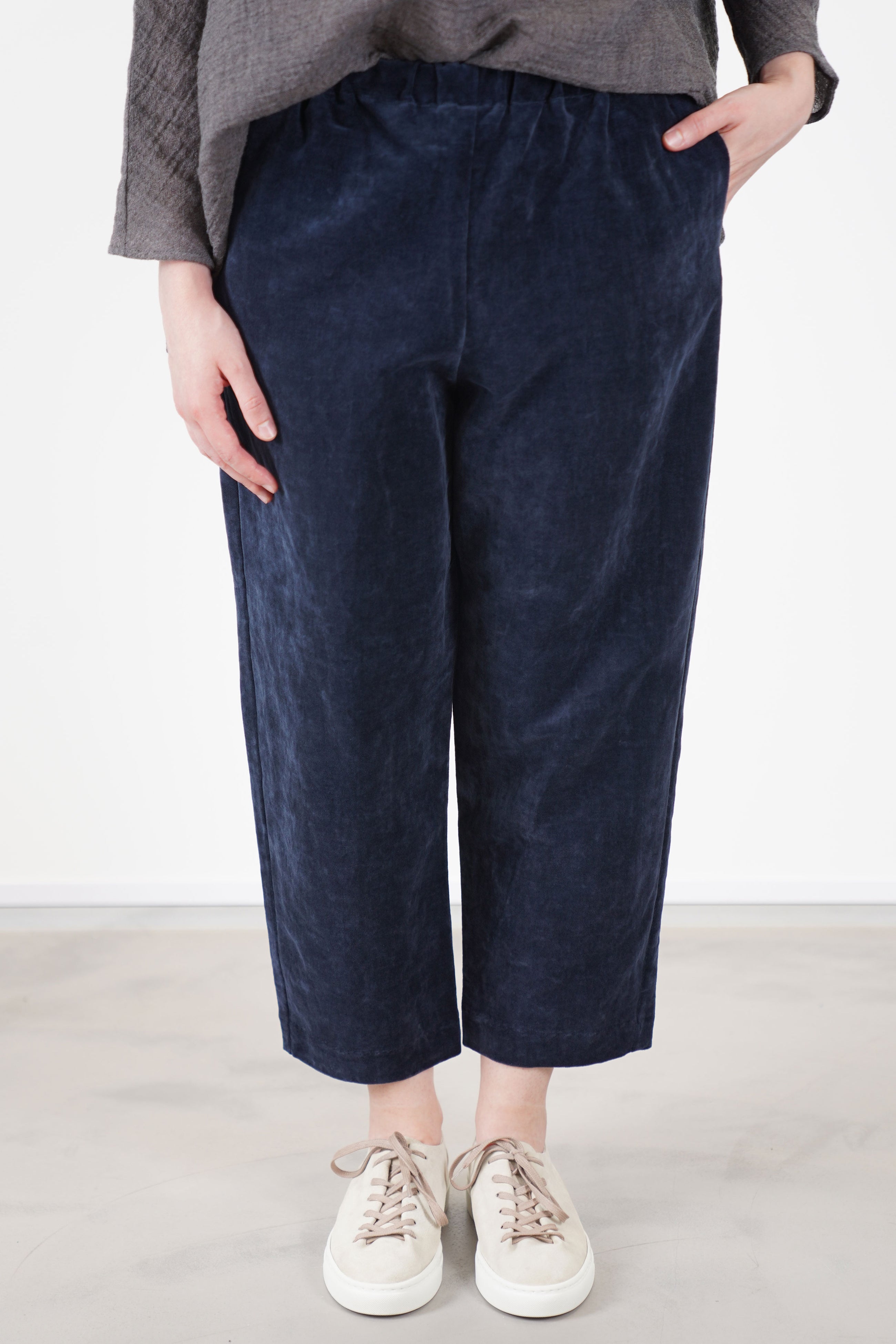 detail front view of apuntob (a.b) velvet trousers blue straight cropped legs and an elasticated waist for comfortable wear.