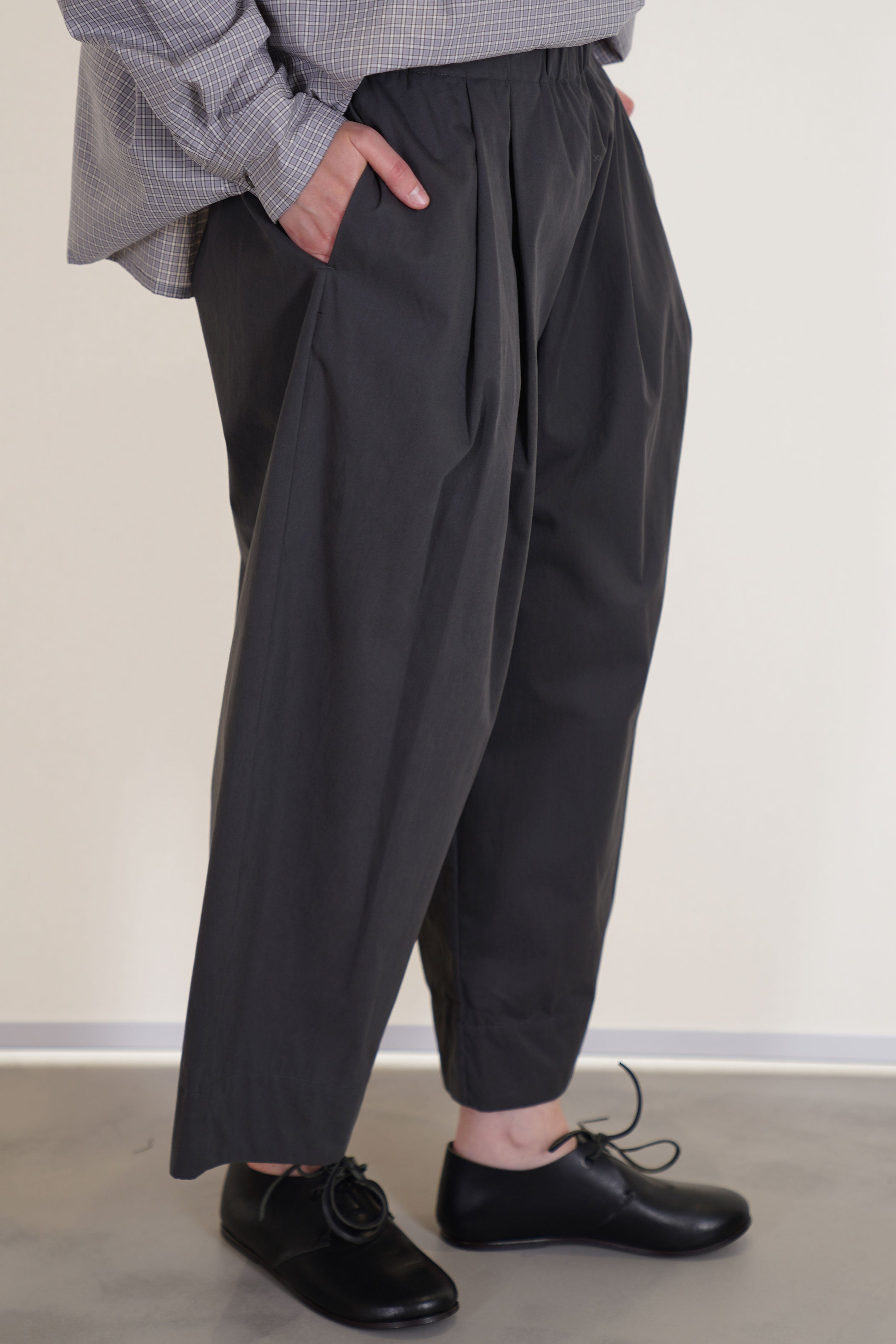apuntob (a.b) trousers stone wide pleat details at the front and an elasticated wasitband
