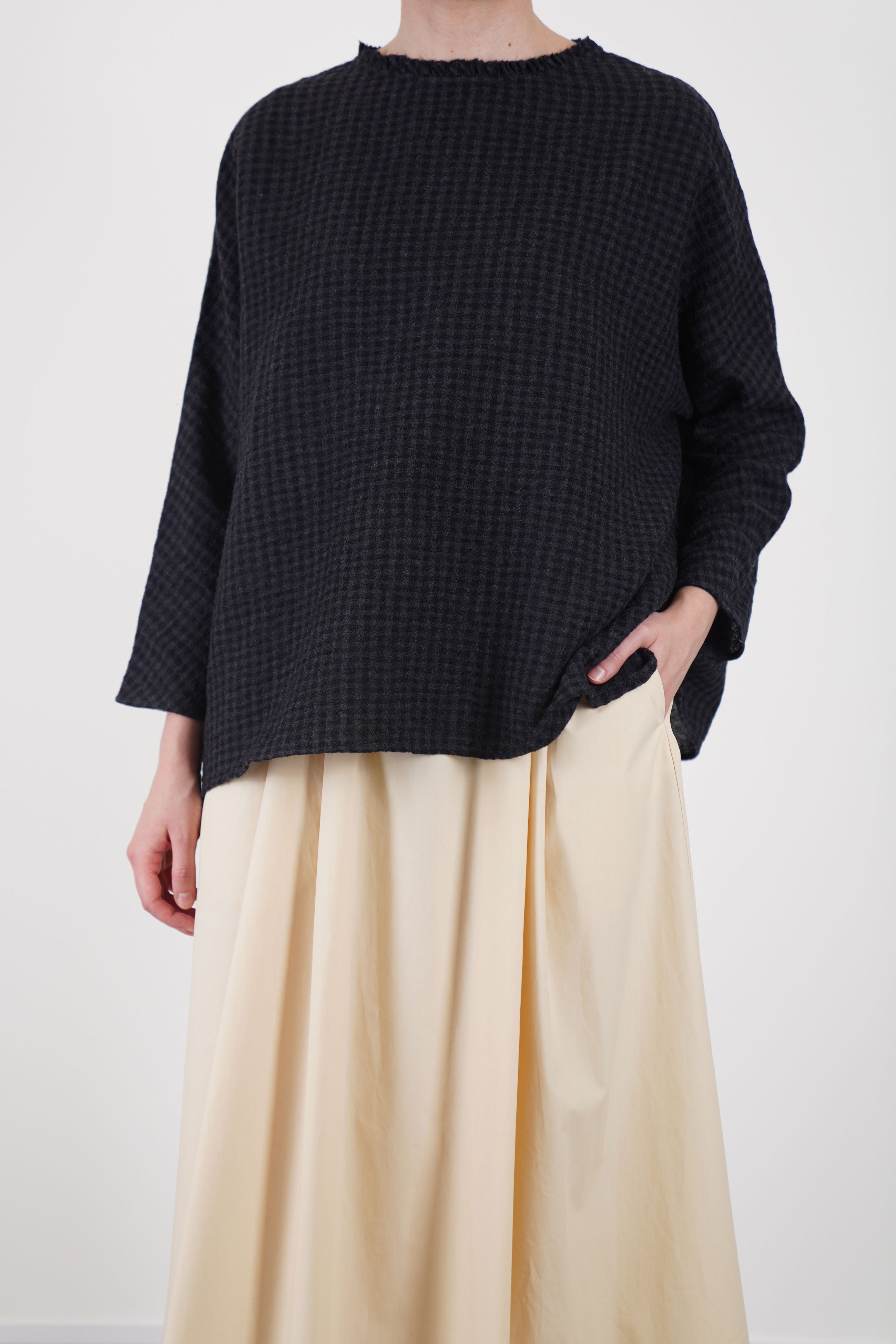 detail view of apuntob (a.b) linen wool shirt anthracite black check showcases subtle ruffle accents at the neckline