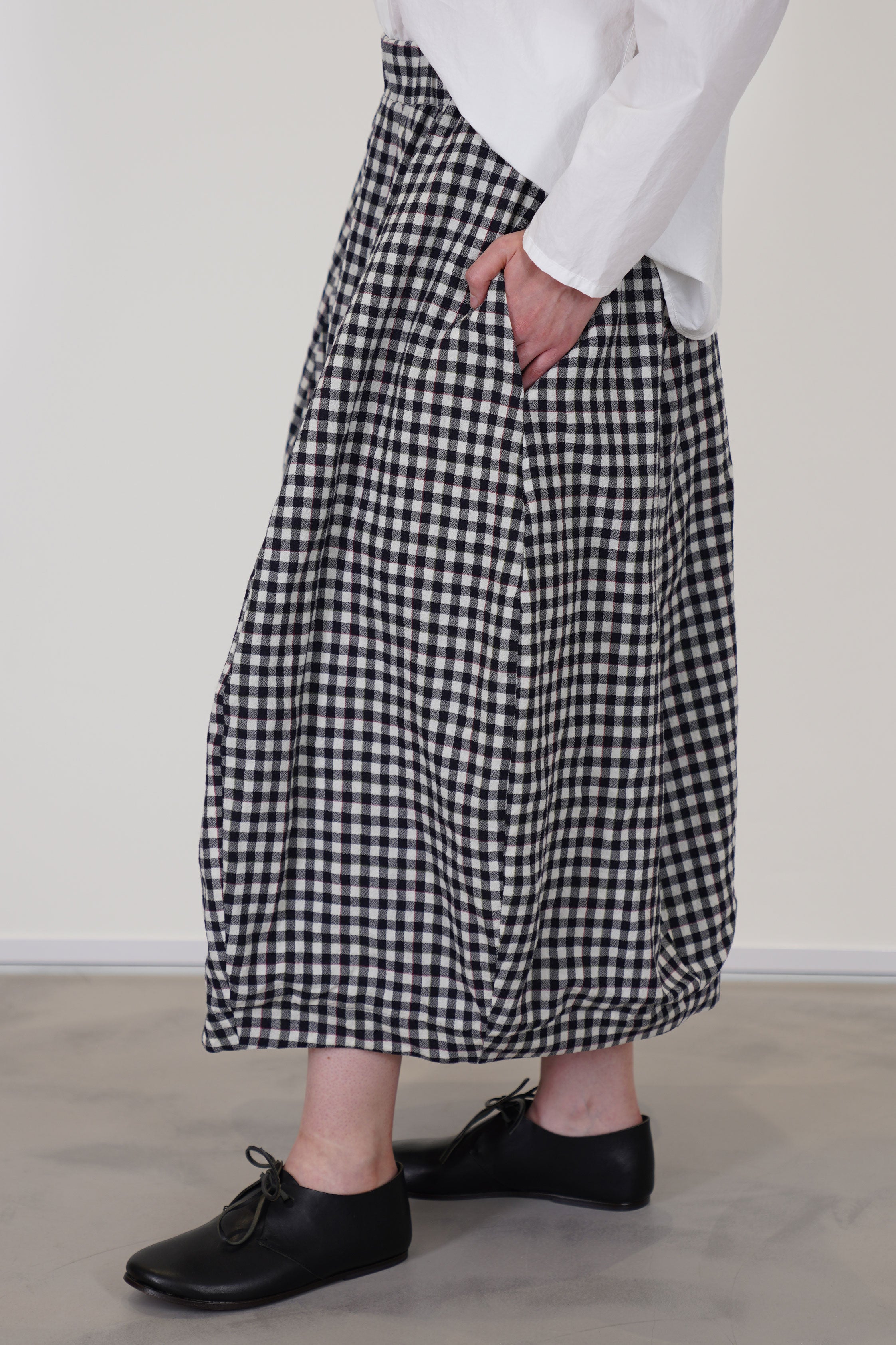 detail view of bergfabel virgin wool carla skirt check side pocket details anf midi length