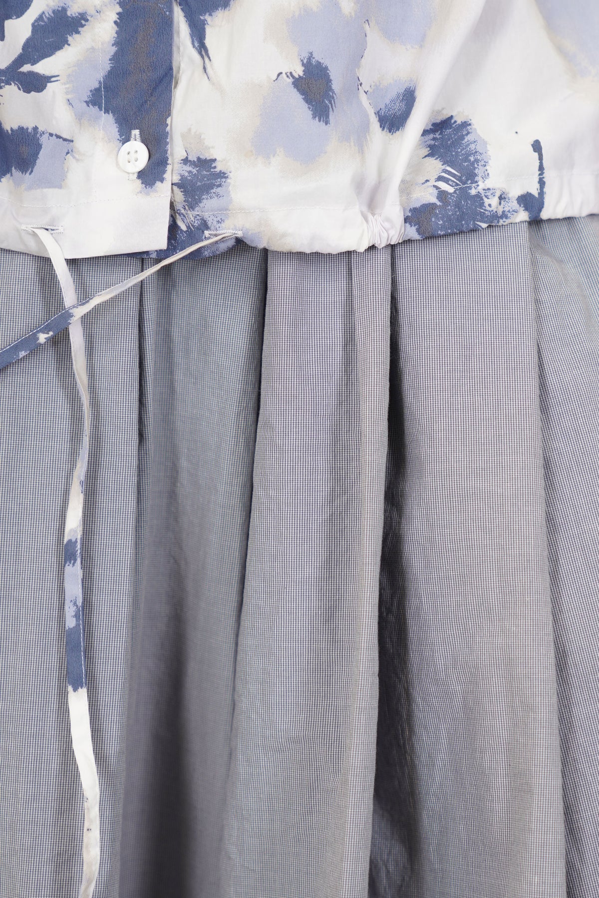 detail view of bergfabel alma shirt blooms strings at the hemline for a more personalised fit