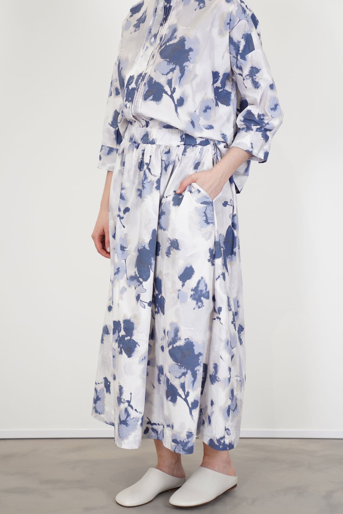 model wearing bergfabel ivy skirt blooms with matching blouse for a structural and distinct minimalist style