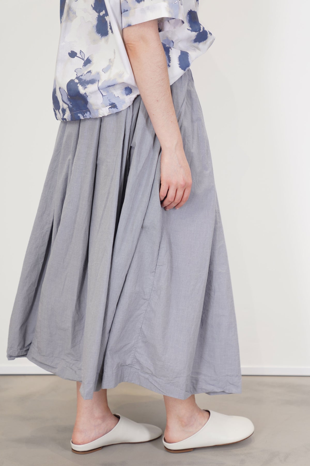 profile view of bergfabel matilde skirt charcoal check midi length and relaxed style