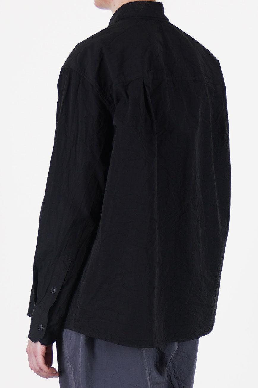 back view of casey casey drays shirt pitch black  designed with a relaxed fit and a tapered long sleeve