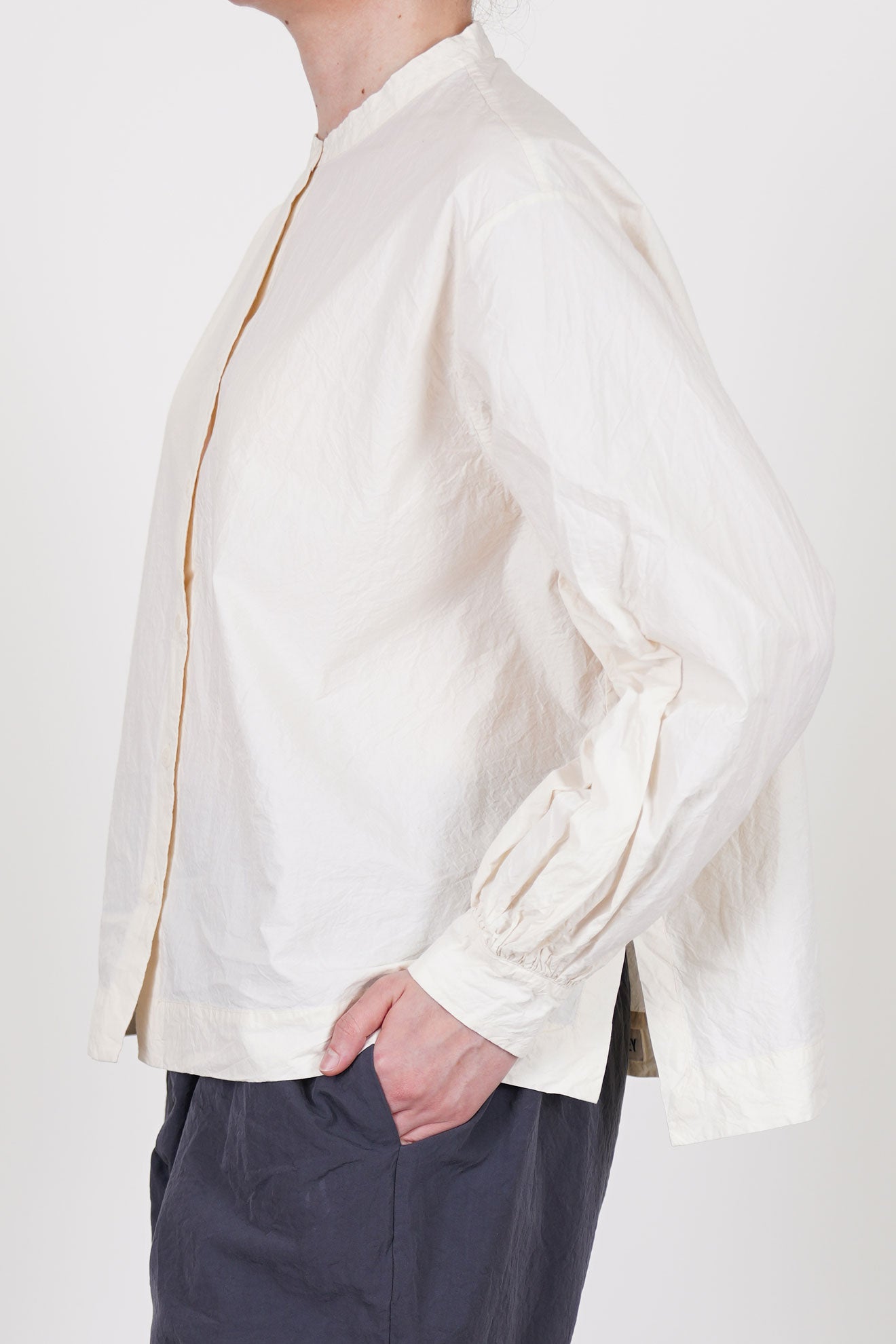 side view of casey casey biggy grandad shirt natural front button opening and voluminous fit