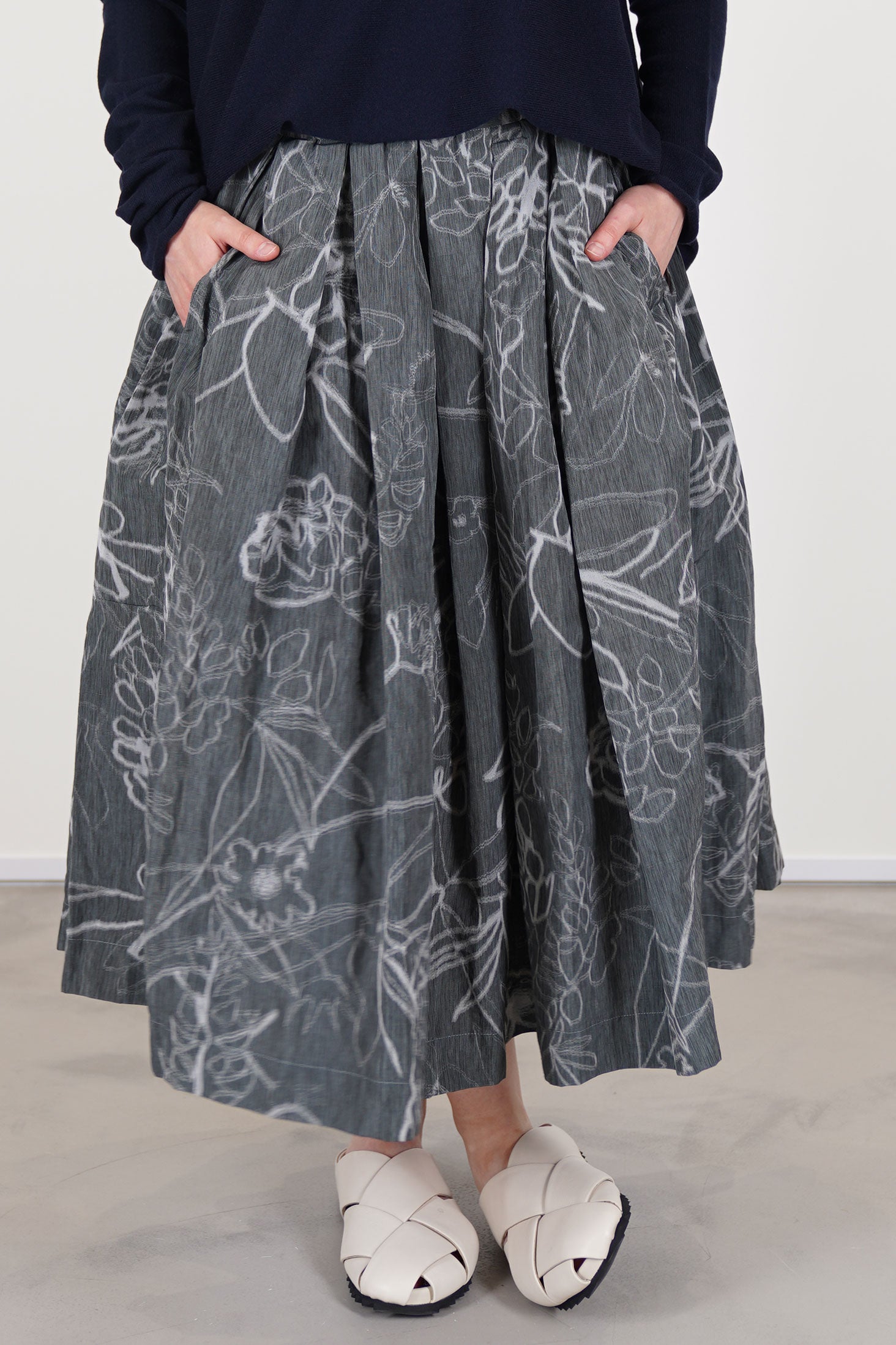 casey casey double rideaux skirt ikat grey  featuring an elasticated waistband with hidden adjustable drawstring, midi length, pleat details and side pockets.