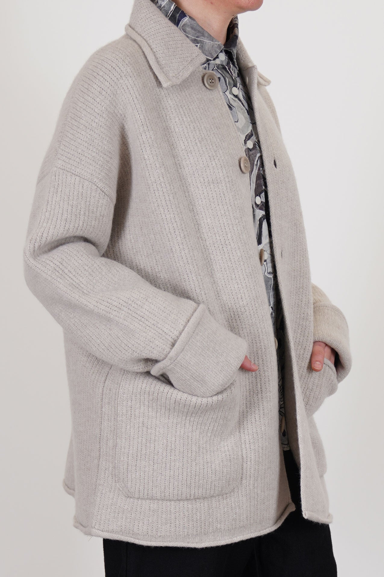 side view of casey casey jacket rove light grey wool relaxed knitted style with drop shoulders, loose fit and big patch pockets.