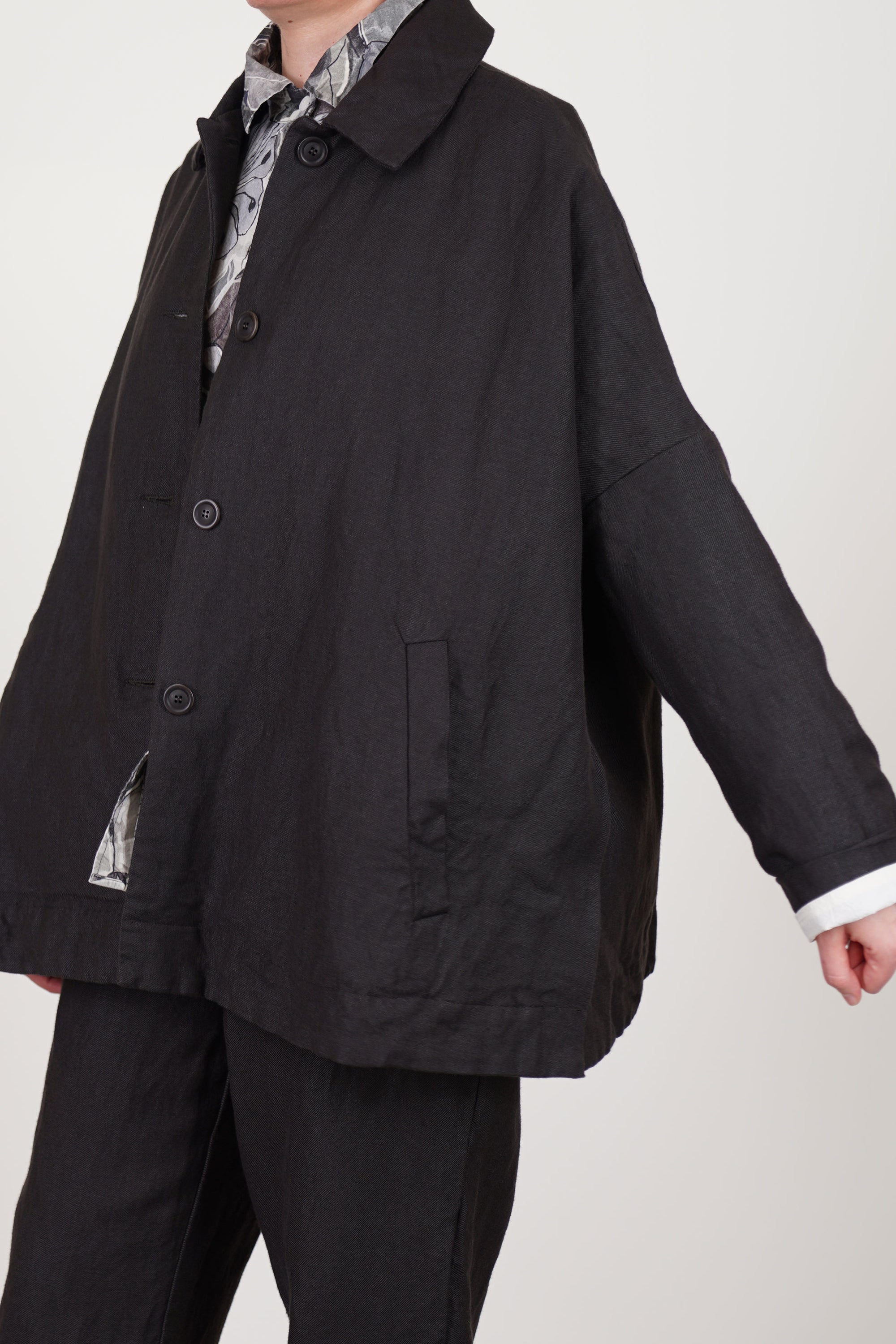 detail view of casey casey sunny bab jacket dark brown fully cotton lined, drop shoulders and tapwered sleeves, corozo front button opening