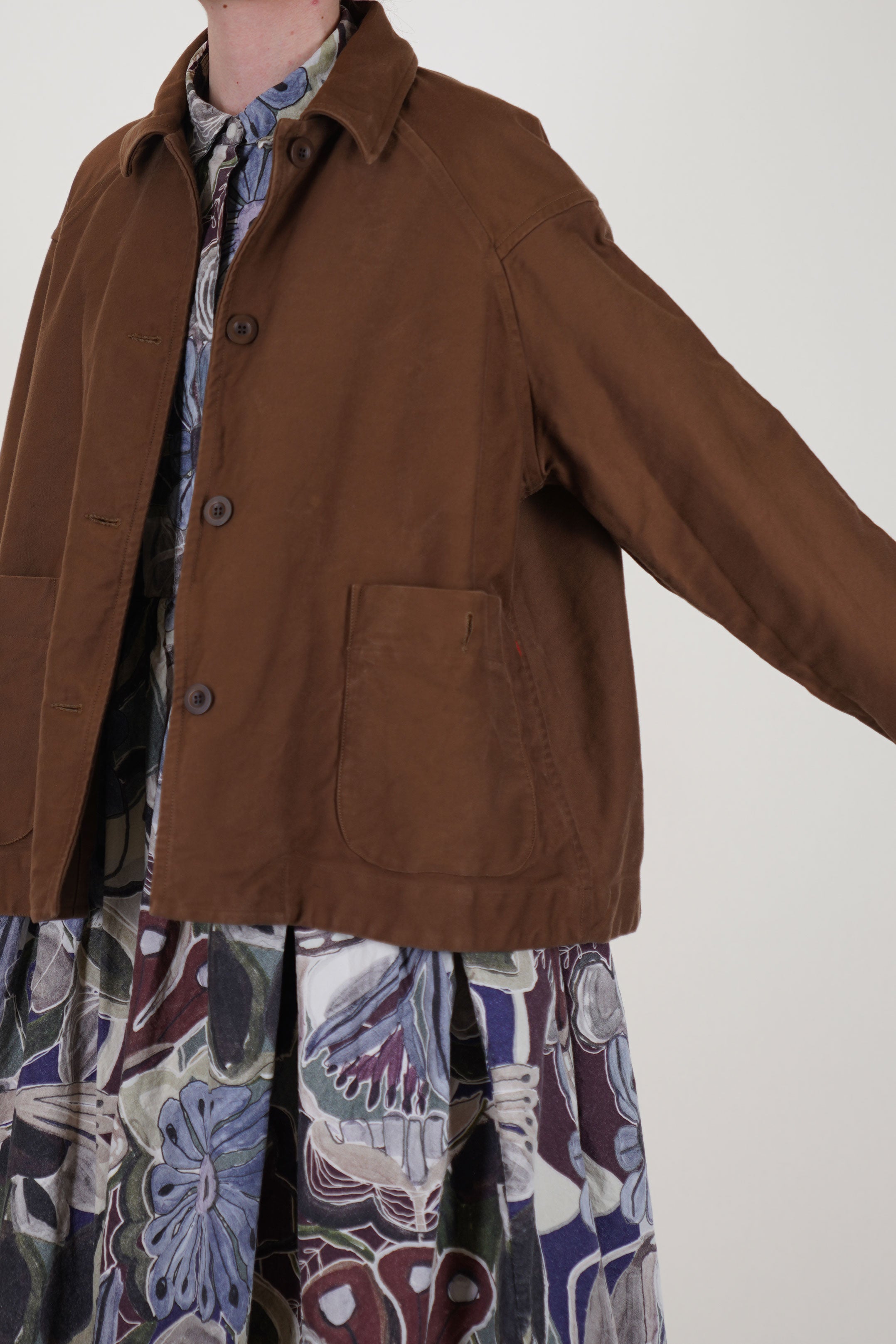 detail view of casey casey drays travail jacket ginger raglan sleeves and oversized fit ensure ease of movement and a relaxed silhouette