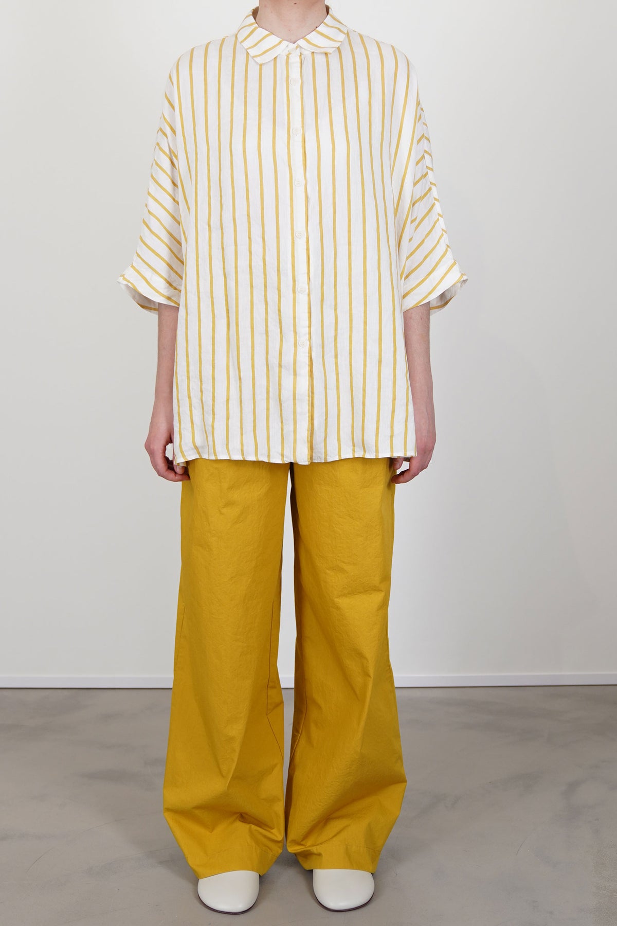 Casey Casey Waga SS Stripe Linen Shirt worn loose with tailored high waisted trousers for a casual look