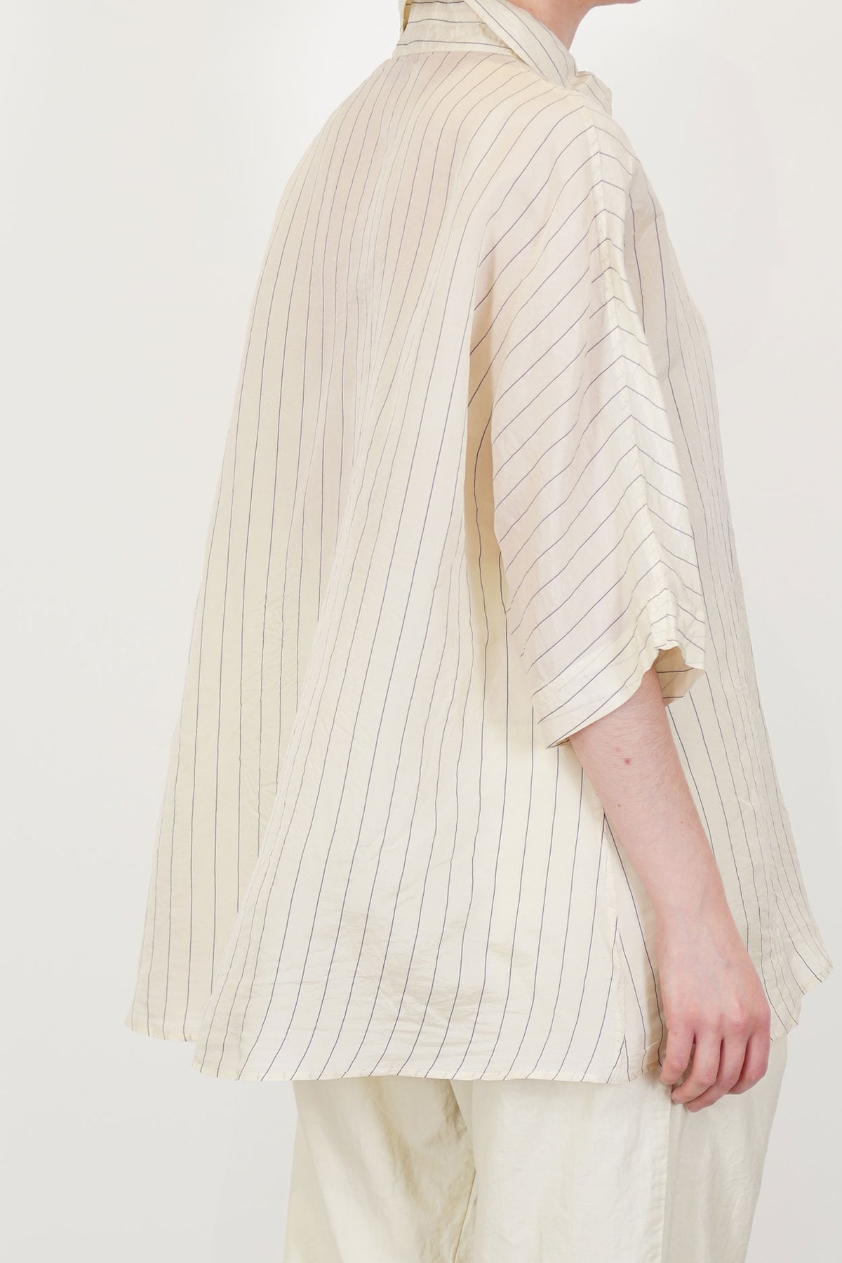profile view of casey casey waga ss shirt silk stripe 1 blouson sleeves and fluid drape