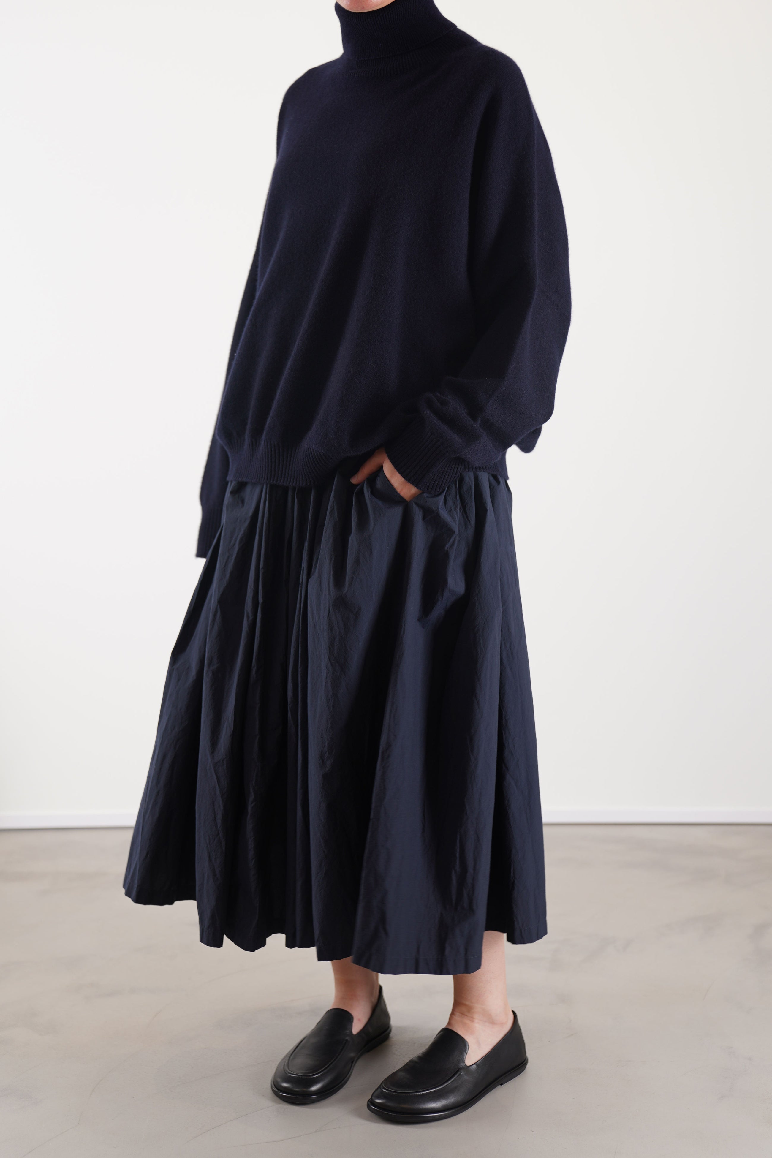 manuelle guibal zam cashmere turtleneck in nocturne, worn with manuelle guibal babe skirt nocture showcasing a cozy, layered look