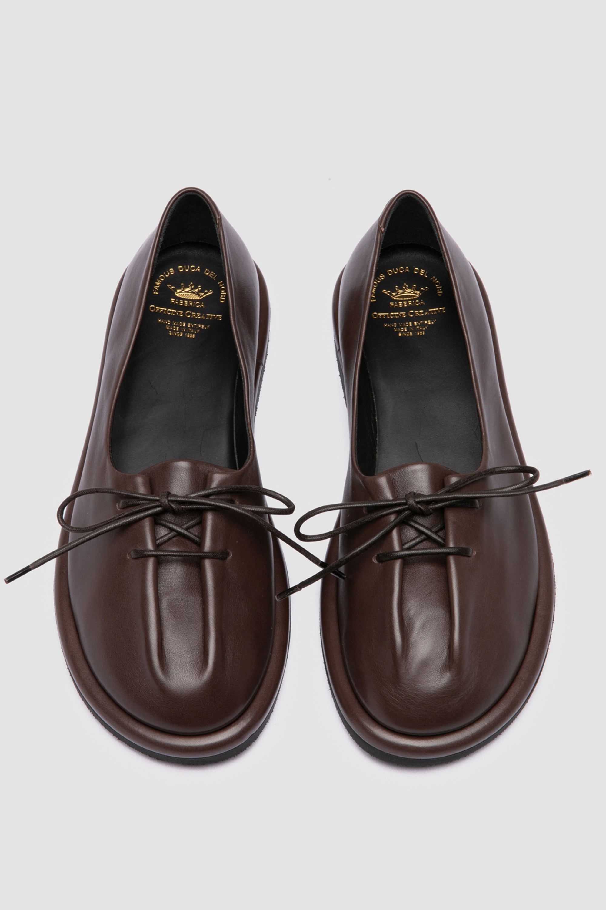 Handmade Italian flats in rich brown leather by Officine Creative, designed with front adjustable laces