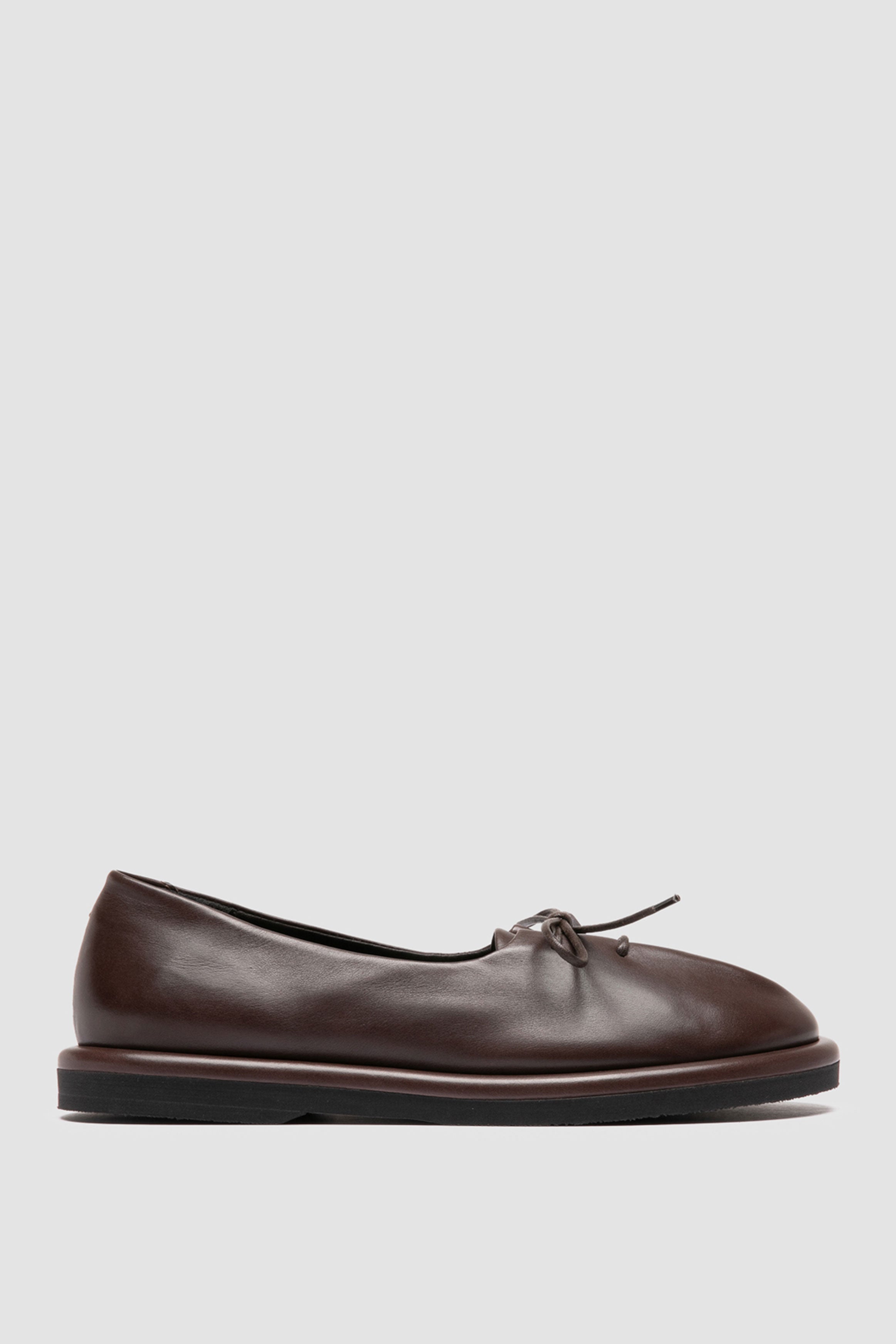 side view of Officine Creative Marjory 104 brown flats showcasing soft leather, front laces