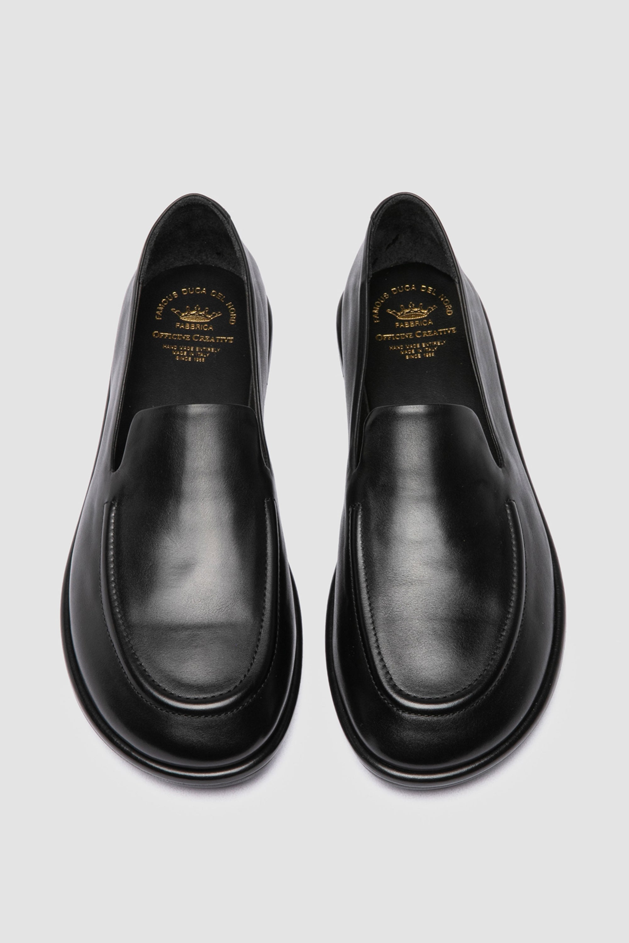 Italian-made black loafers by Officine Creative, crafted from premium supple leather