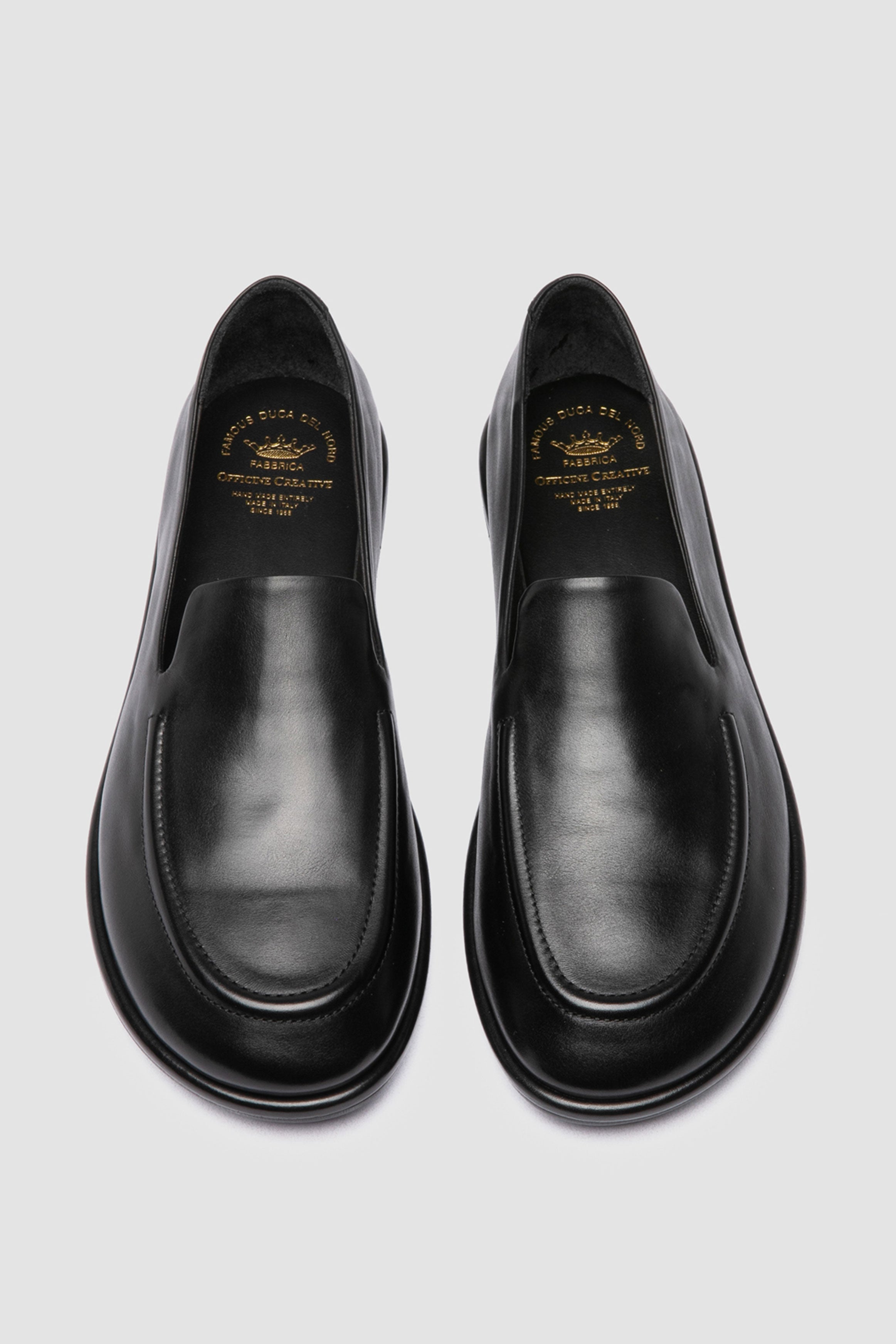 Italian-made black loafers by Officine Creative, crafted from premium supple leather