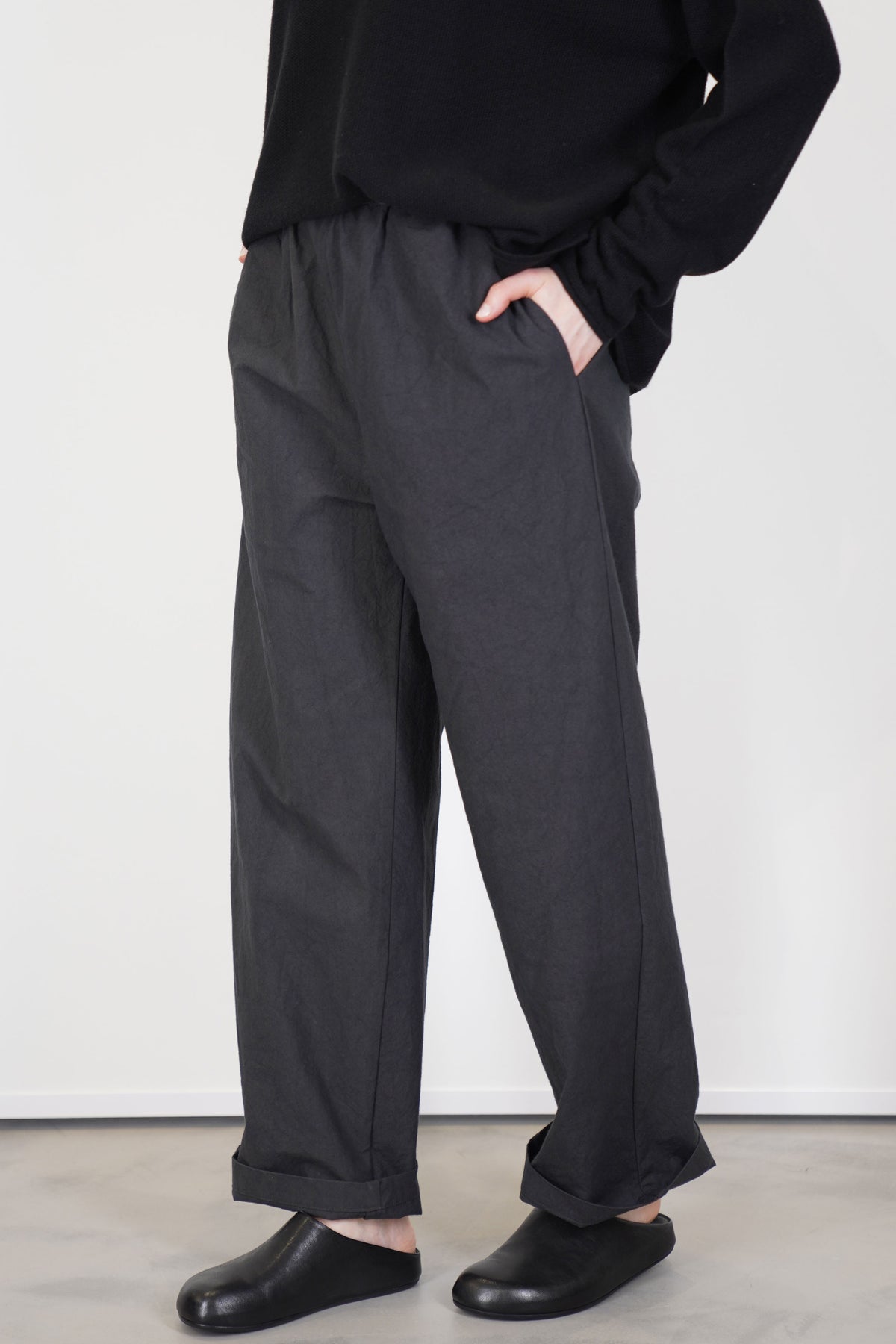 profile view of oyuna passage trousers earth long tapered legs