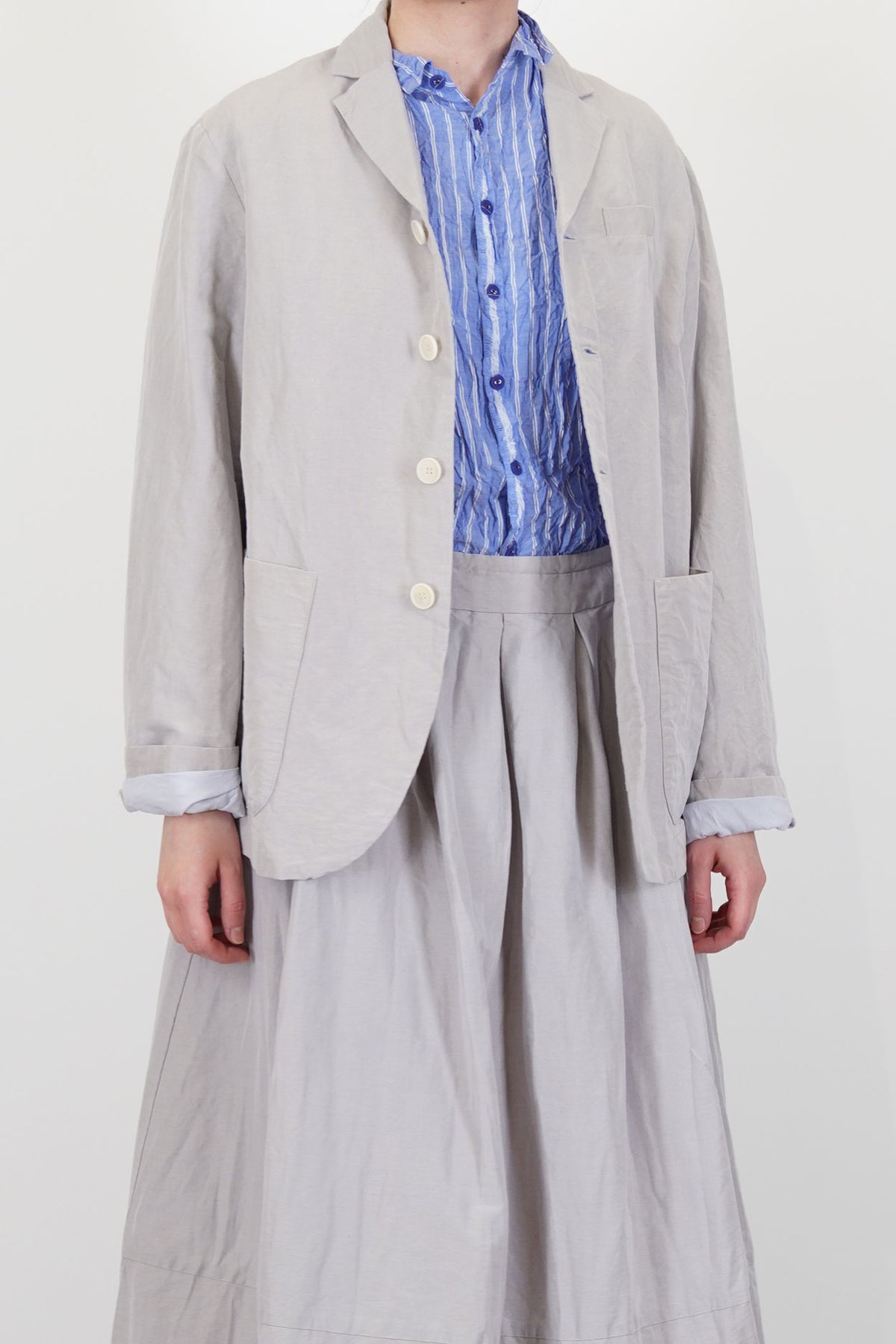 front view of pas de calais jacket cotton linen grey button front opening and long sleeves