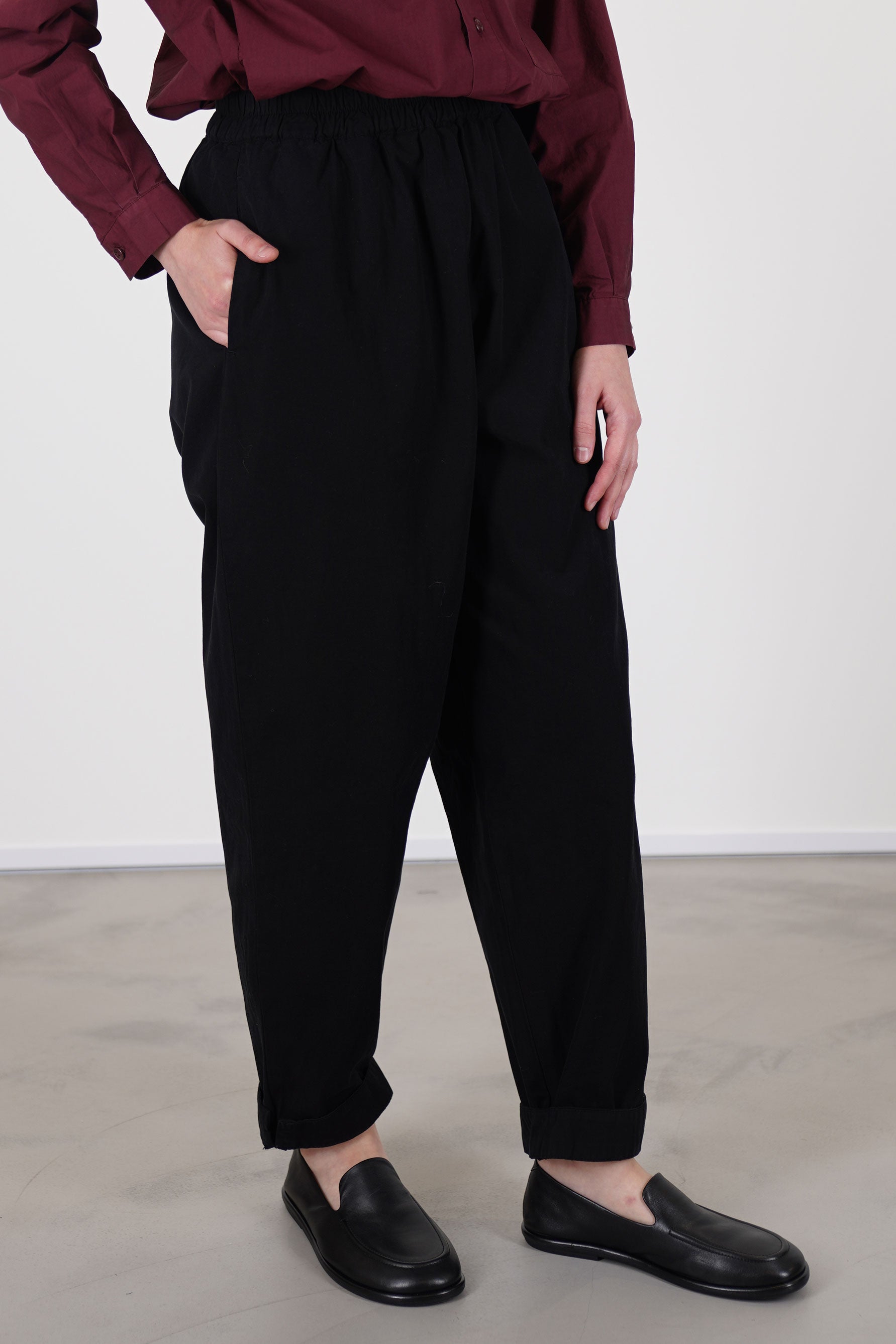 profile view of toogood gymast trousers black crafted from a soft fabric with a gently brushed cotton texture for comfort.