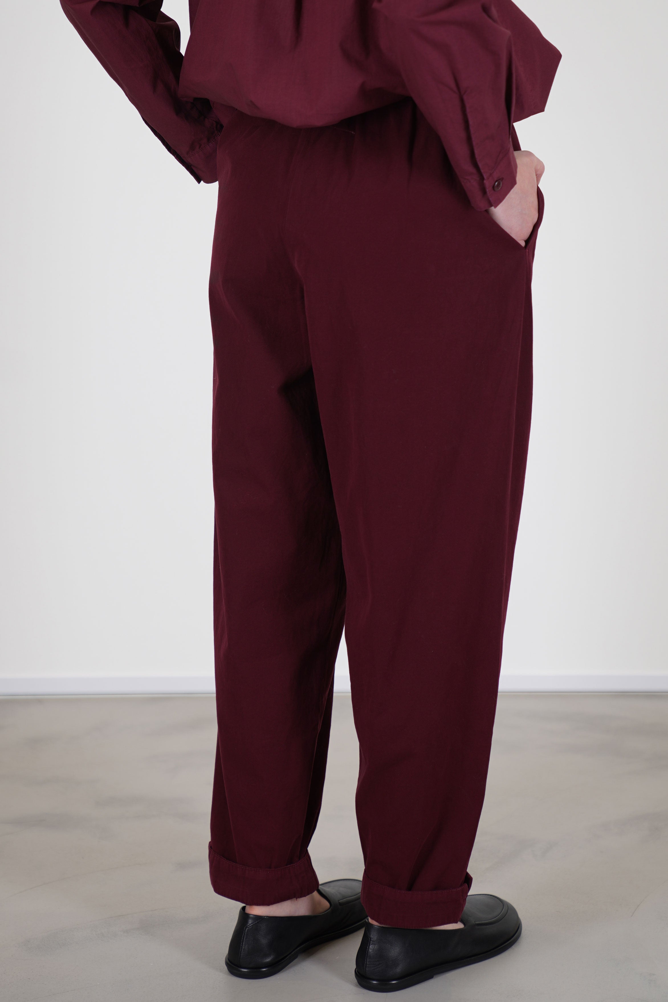 back view of toogood gymast trousers port relaxed and loose fit with tapered legs