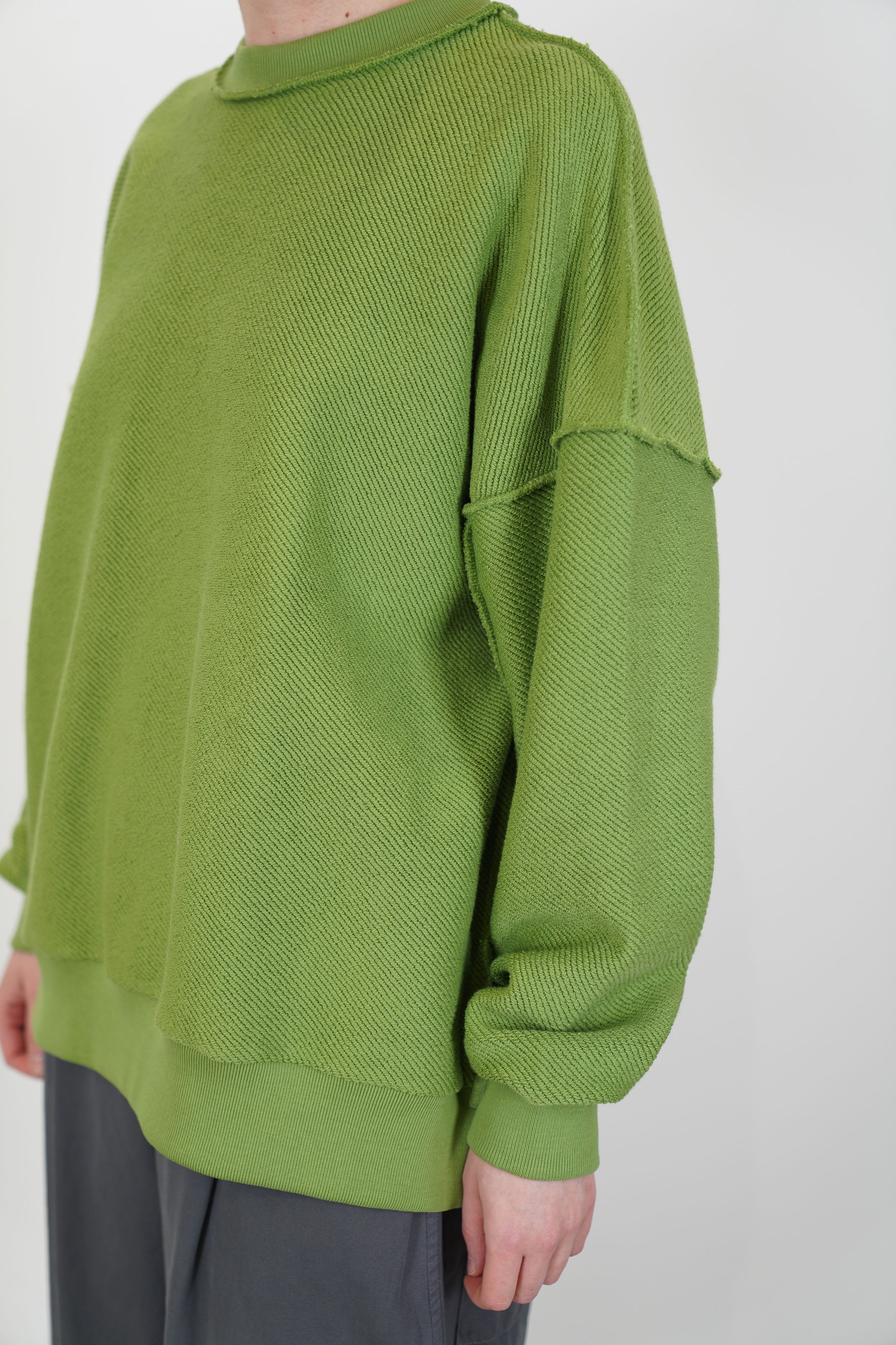 front view of toogood mechanic jumper loopback twill grass structured material and intentionally visible stitching