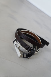 profile view of sofie d'hoore leather belt varnia cacao together with asme belts in various colors