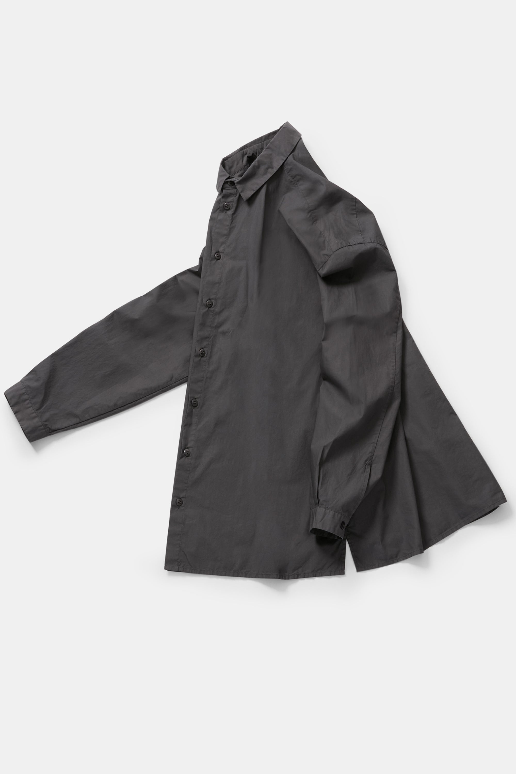 profile product view of toogood draughtsman shirt poplin pencil emphasizing the long tapered sleeves and side slit details