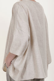 side detail view of apuntob (a.b) shirt cashmere natural wide and relaxed silhouette, dropped shoulders, and elbow length sleeves