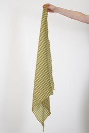 apuntob (a.b) cashmere small stole acid features a checkered square design with delicate frayed edges along the sides