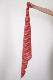 apuntob (a.b) cashmere small stole red features a checkered square design with delicate frayed edges along the sides