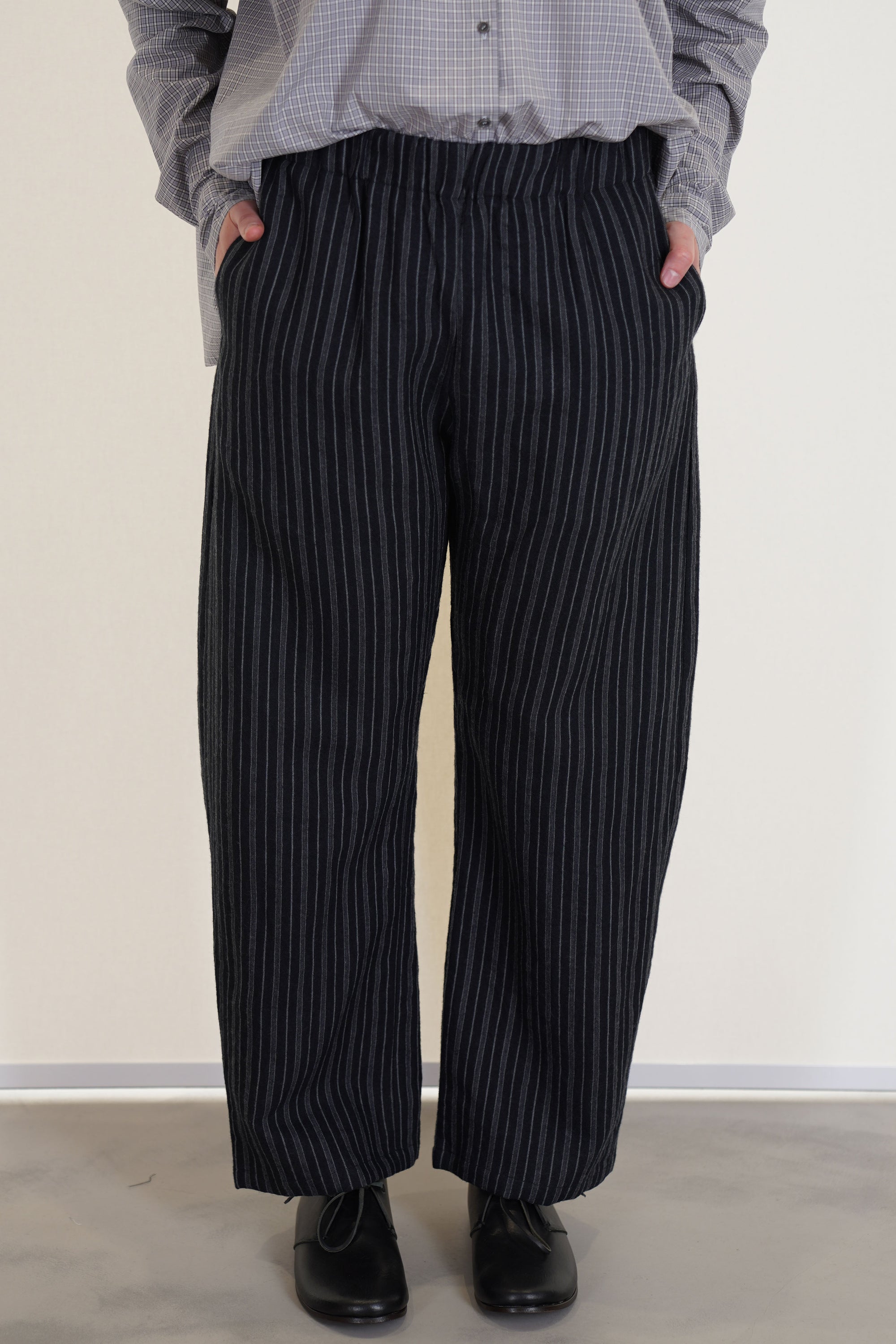 apuntob (a.b) trousers stripes black crafted in a soft linen-virgin wool blend striped material. 