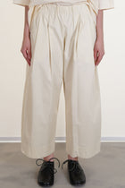 apuntob (a.b) trousers natural featuring a cropped length, wide pleat details at the front and an elasticated wasitband