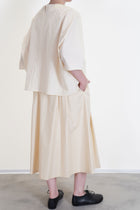 back view of apuntob (a.b) shirt natural worn with skirt natural relaxed cut