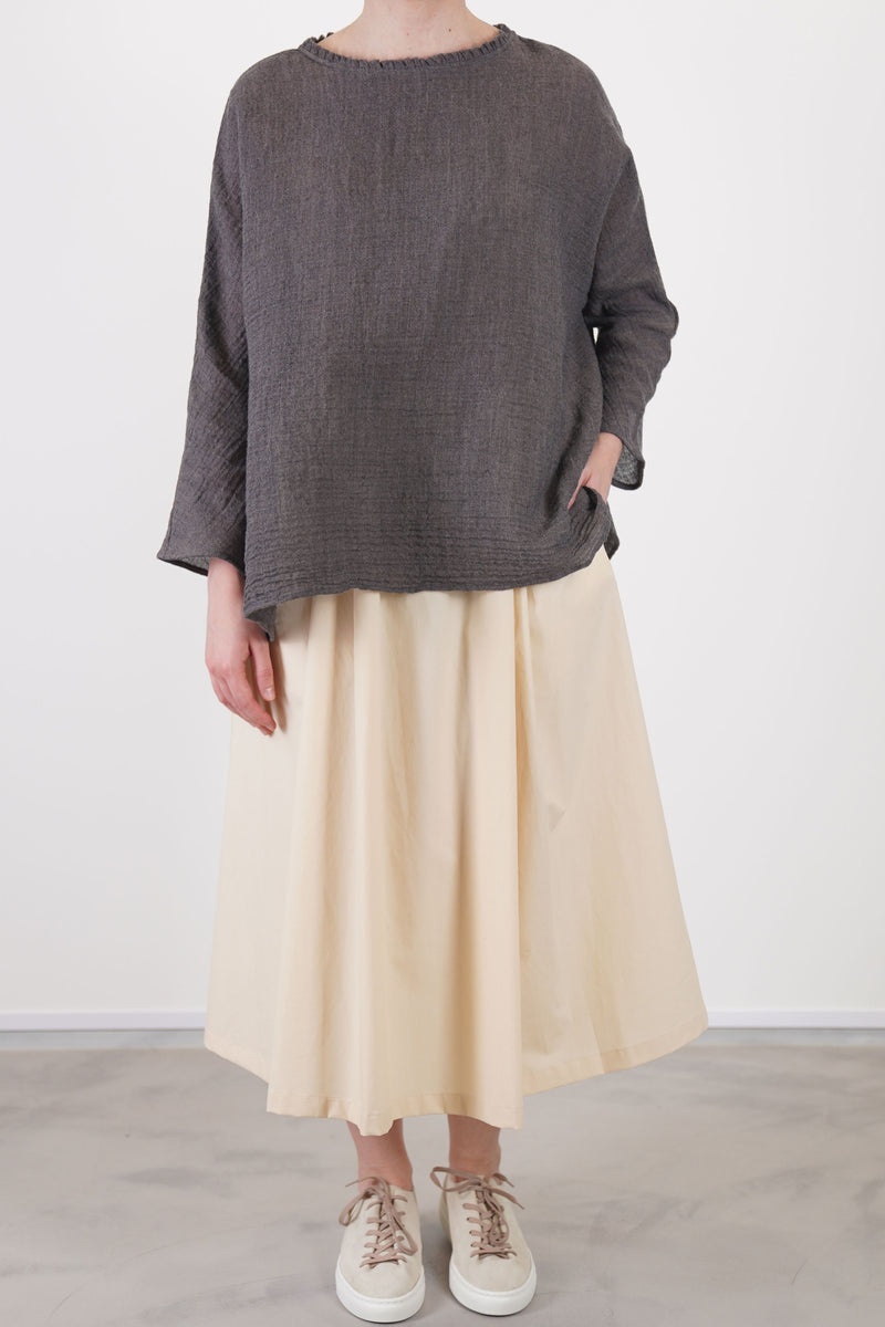 front view of apuntob (a.b) linen wool shirt walnut showcases subtle ruffle accents at the neckline and a wide and relaxed silhouette