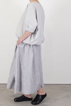 profile view of apuntob (a.b) shirt fine stripes meringue drop shoulders and soft drape