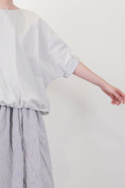 detail view of apuntob (a.b) shirt fine stripes meringue wide silhouette and double-layered material