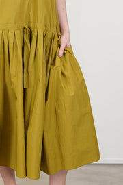 close up view of apuntob (a.b) dress oil pleated details and adjustable drawstring at the waistband