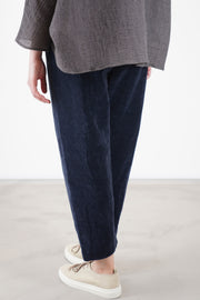 back view of apuntob (a.b) velvet trousers blue relaxed tapered leg making them ideal for stylish everyday wear with effortless ease.