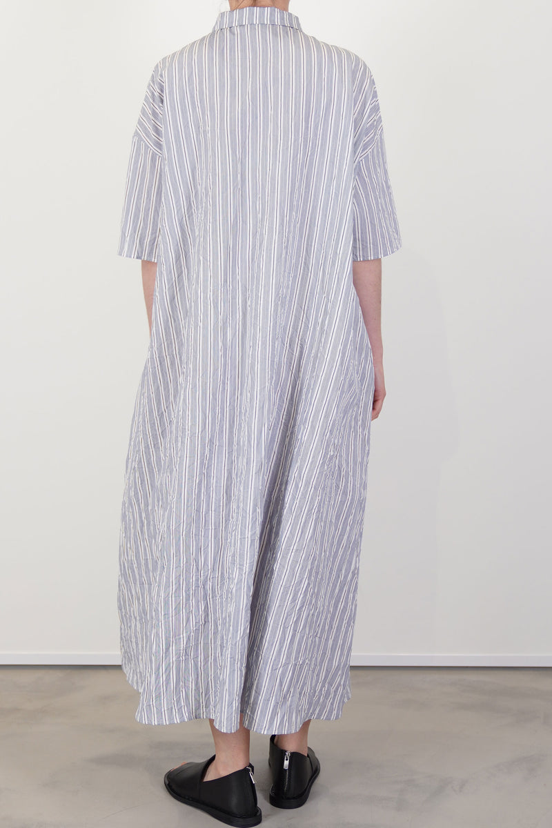 back view of apuntob (a.b) dress abyss elbow length sleeves and midi length