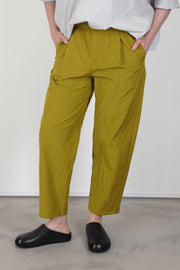 model wearing apuntob (a.b) trousers oil 