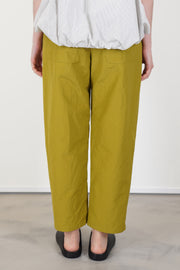 back view of apuntob (a.b) trousers oil  tapeerd leg and back pocket fine details