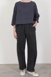 front view of apuntob (a.b) trousers cord stone featuring an elasticated waistband for a flexible, secure fit and a curved leg design