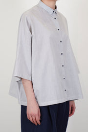 profile view of apuntob (a.b) shirt check meringue